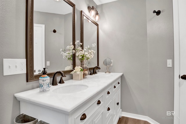 bathroom featuring vanity and wood-type flooring