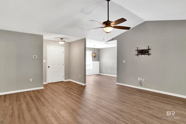 unfurnished room with lofted ceiling, ceiling fan, and hardwood / wood-style floors