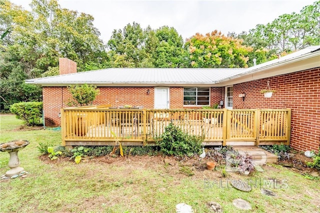 wooden deck with a yard