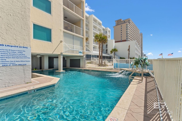 community pool featuring fence