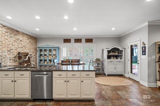 kitchen with ornamental molding, a wealth of natural light, a sink, and dishwasher