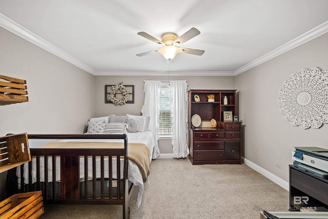 carpeted bedroom with crown molding, a ceiling fan, and baseboards