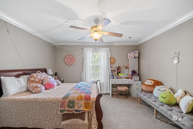 carpeted bedroom with ornamental molding and a ceiling fan
