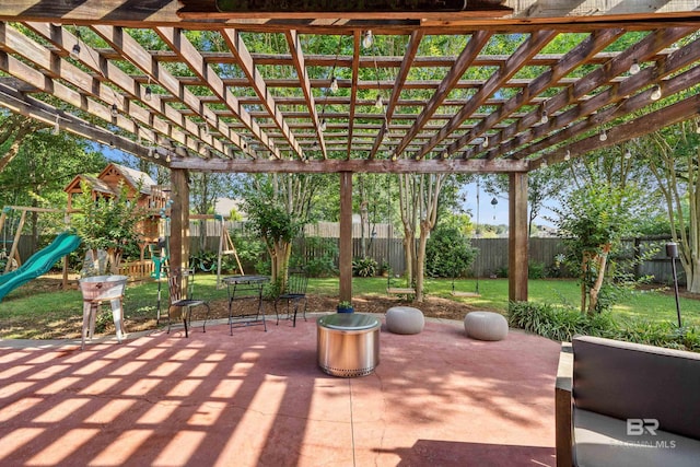 view of patio with a playground, a pergola, and a fenced backyard