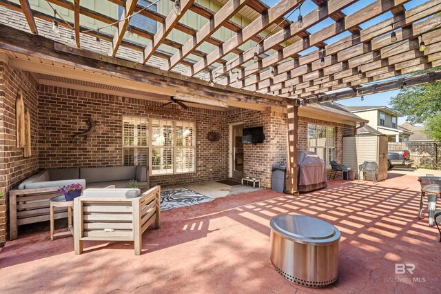 view of patio with a pergola, ceiling fan, and an outdoor living space