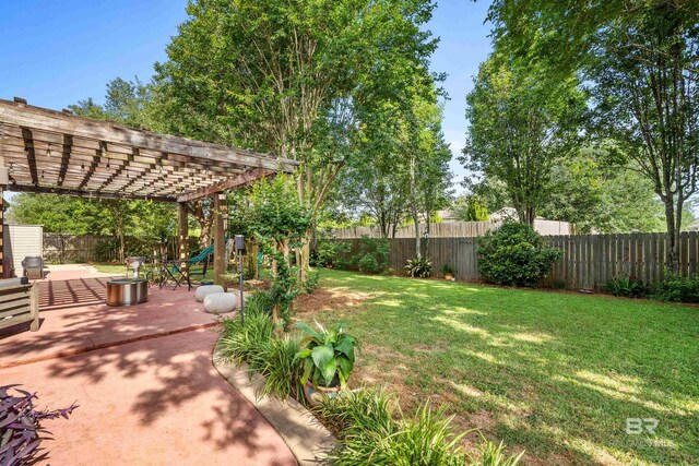 view of yard featuring a patio, a fenced backyard, and a pergola