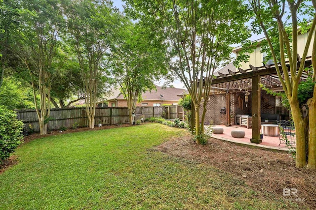 view of yard featuring a patio, a fenced backyard, and a pergola