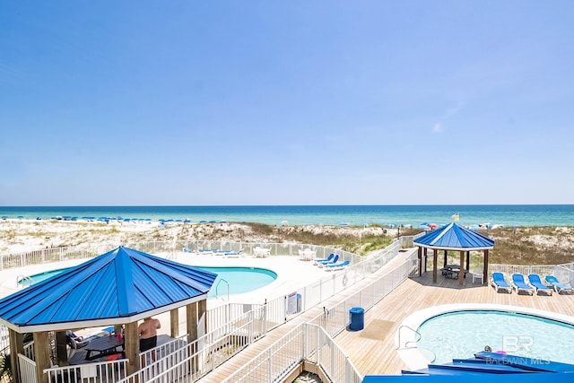 23044 Perdido Beach Blvd Unit 338, Orange Beach, AL 36561 - community pool with a gazebo, view of local beach, and a deck with water view