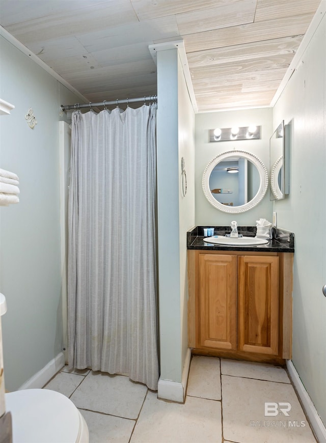 23044 Perdido Beach Blvd Unit 338, Orange Beach, AL 36561 - full bath featuring vanity, tile patterned floors, baseboards, toilet, and crown molding
