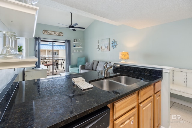 23044 Perdido Beach Blvd Unit 338, Orange Beach, AL 36561 - kitchen with a sink, ceiling fan, lofted ceiling, dark stone countertops, and dishwashing machine