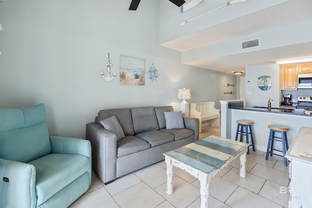 23044 Perdido Beach Blvd Unit 338, Orange Beach, AL 36561 - living area featuring light tile patterned flooring and ceiling fan