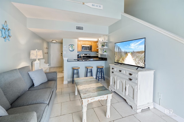 23044 Perdido Beach Blvd Unit 338, Orange Beach, AL 36561 - living room featuring light tile patterned floors and baseboards