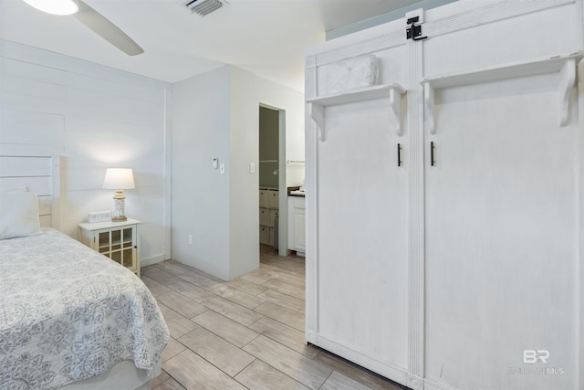 23044 Perdido Beach Blvd Unit 338, Orange Beach, AL 36561 - bedroom featuring wood tiled floors and a ceiling fan