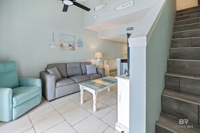 23044 Perdido Beach Blvd Unit 338, Orange Beach, AL 36561 - living area with stairway, a ceiling fan, and light tile patterned flooring