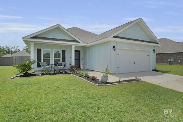 9365 Eiland Dr, Foley, AL 36535 - ranch-style home featuring a porch, an attached garage, concrete driveway, a shingled roof, and board and batten siding