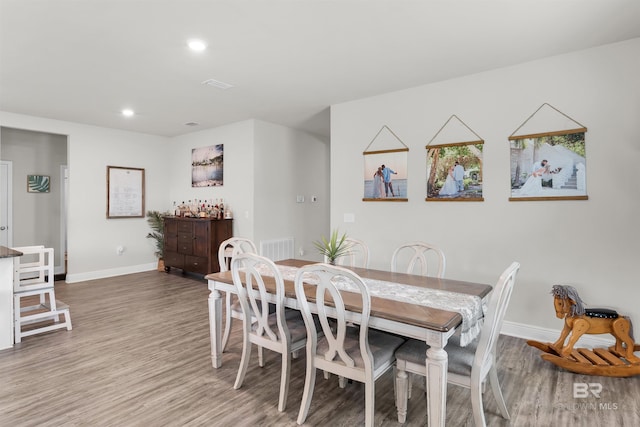 9365 Eiland Dr, Foley, AL 36535 - dining room with baseboards, wood finished floors, and recessed lighting