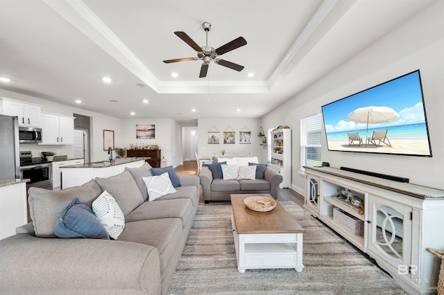 9365 Eiland Dr, Foley, AL 36535 - living room with ceiling fan, recessed lighting, crown molding, and a tray ceiling