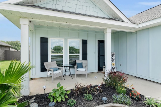 9365 Eiland Dr, Foley, AL 36535 - entrance to property featuring board and batten siding, a porch, and roof with shingles