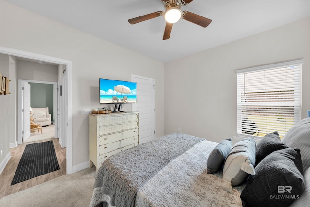 9365 Eiland Dr, Foley, AL 36535 - bedroom with light colored carpet, baseboards, and ceiling fan