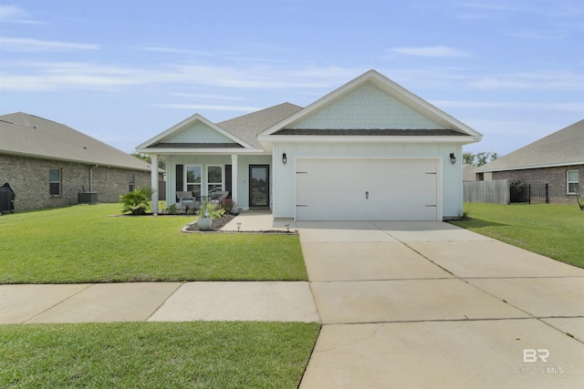 9365 Eiland Dr, Foley, AL 36535 - view of front of property with a garage, concrete driveway, central AC unit, and board and batten siding