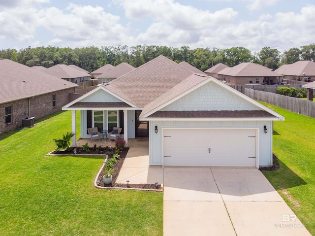 9365 Eiland Dr, Foley, AL 36535 - view of front of home featuring central air condition unit, a shingled roof, driveway, and a garage