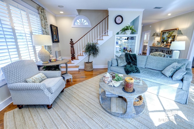 living room featuring ornamental molding and hardwood / wood-style flooring