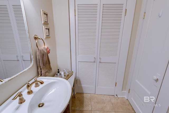 bathroom featuring tile flooring and sink