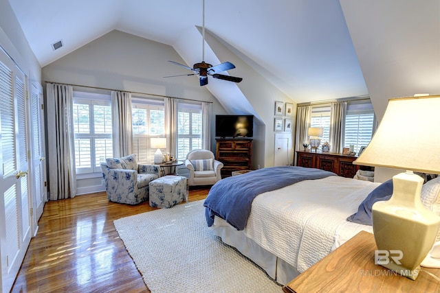 bedroom featuring ceiling fan, vaulted ceiling, and hardwood / wood-style floors