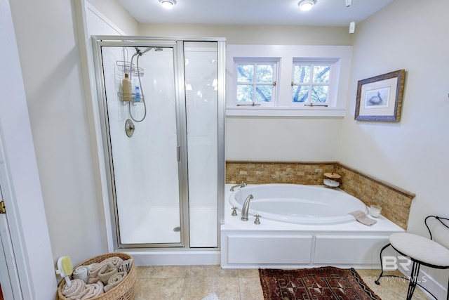 bathroom featuring tile floors and plus walk in shower