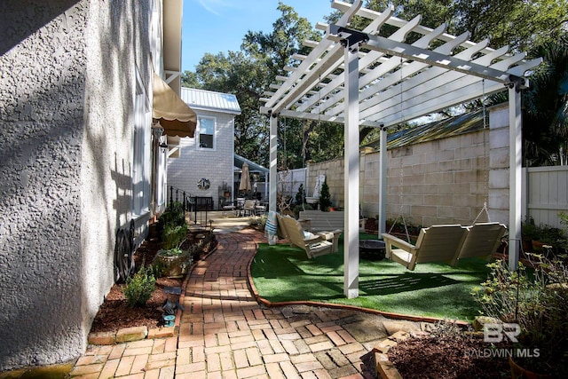 exterior space with a pergola and a patio