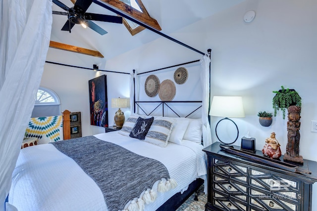 bedroom featuring vaulted ceiling with beams and ceiling fan