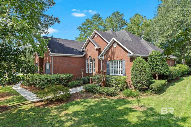 view of front of house featuring a front yard and a garage