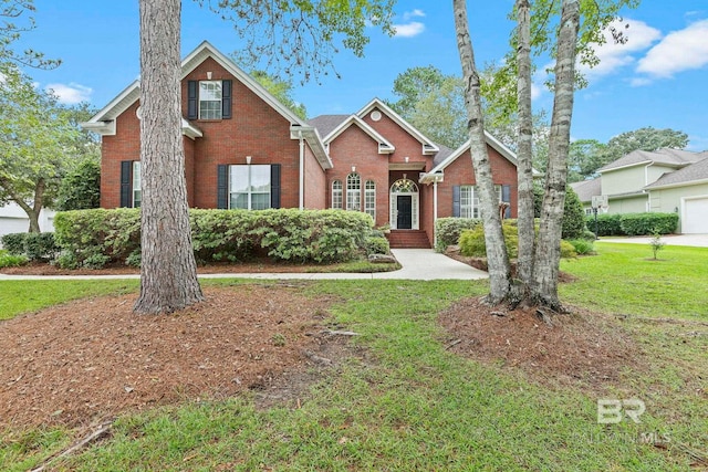 view of property featuring a front lawn