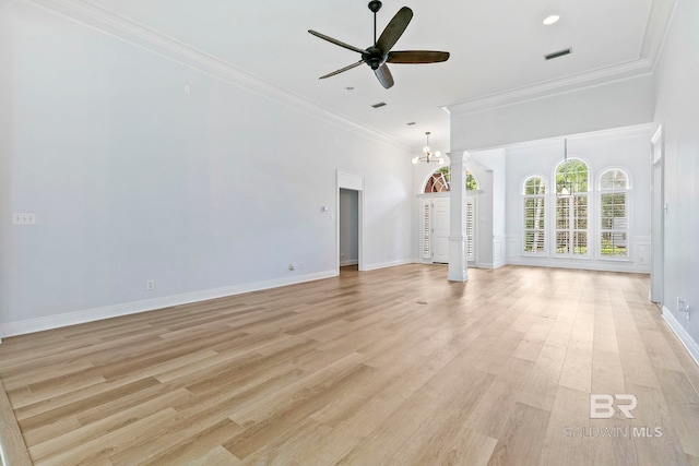 unfurnished living room featuring ceiling fan with notable chandelier, ornamental molding, and light hardwood / wood-style flooring