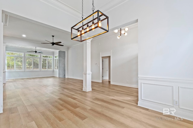 interior space featuring ornate columns, ornamental molding, ceiling fan, and light hardwood / wood-style flooring