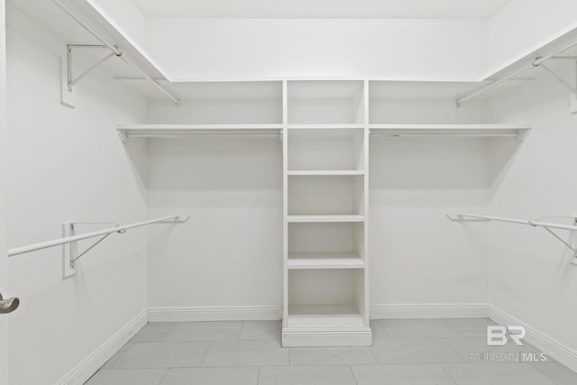 walk in closet featuring light tile patterned floors