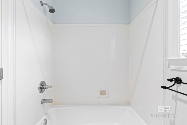 bathroom with bathing tub / shower combination