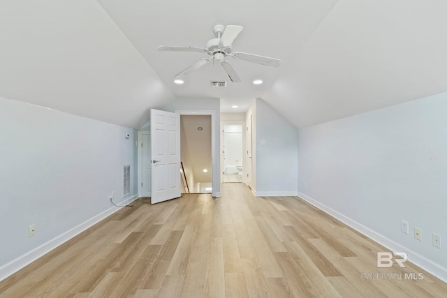 additional living space featuring light wood-type flooring, vaulted ceiling, and ceiling fan