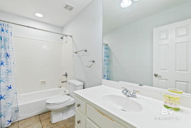 full bathroom with shower / bath combo with shower curtain, tile patterned floors, vanity, and toilet