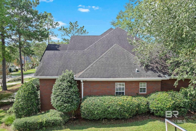 view of side of property with a yard