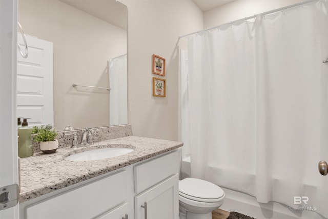 full bathroom featuring shower / bathtub combination with curtain, vanity, and toilet