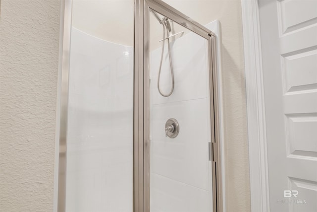 bathroom featuring an enclosed shower