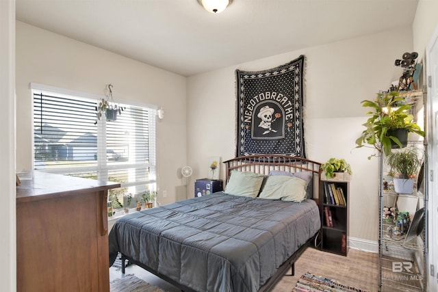 bedroom featuring wood-type flooring