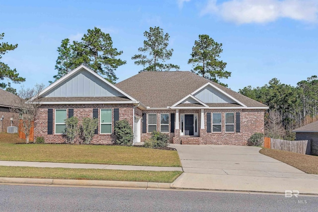 craftsman-style house with a front lawn