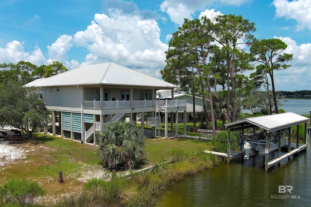 rear view of property featuring a water view