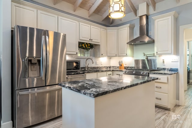 kitchen with a center island, dark stone counters, wall chimney exhaust hood, appliances with stainless steel finishes, and wood ceiling