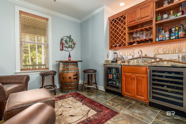 bar with wine cooler, crown molding, and sink