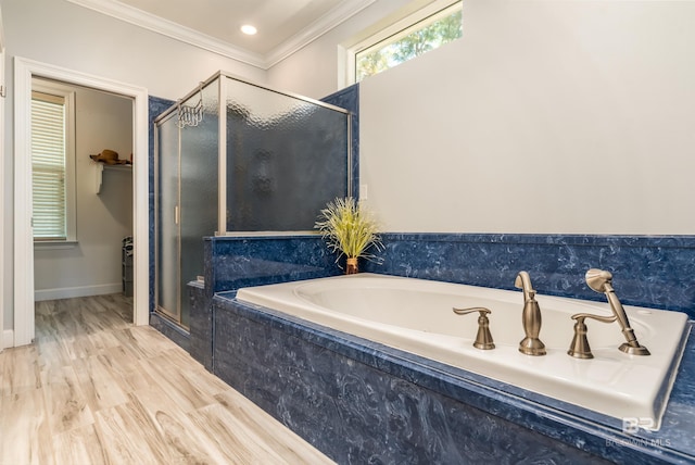 bathroom featuring hardwood / wood-style floors, independent shower and bath, and ornamental molding