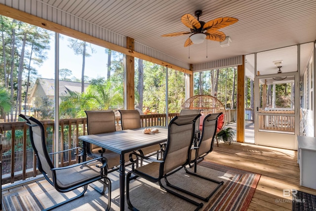 sunroom / solarium featuring ceiling fan