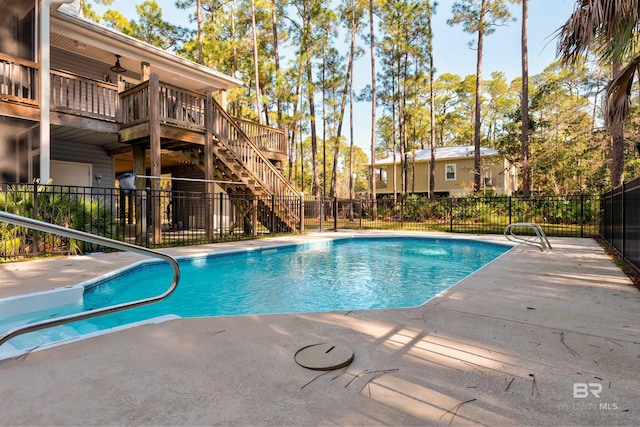 view of pool featuring ceiling fan and a patio area